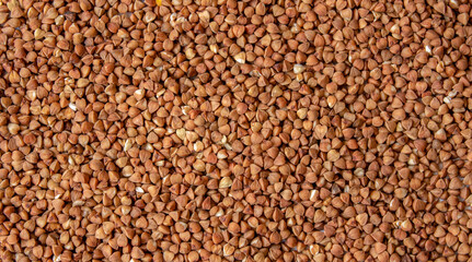 Buckwheat, buckwheat background, buckwheat texture, loose buckwheat