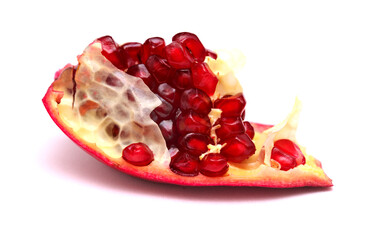 Red ripe pomegranate fruit grains on white background