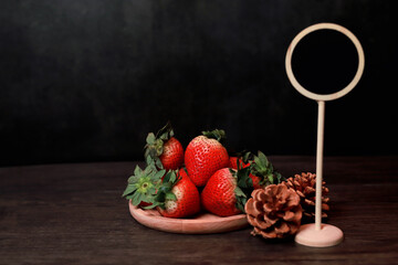 Large strawberries in a wooden tray