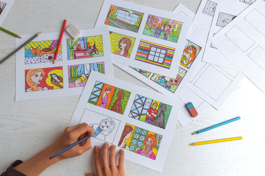 Drawing a colored storyboard. The illustrator creates comics on paper.