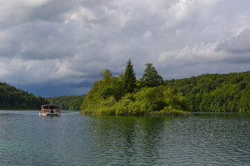 Fototapeta premium Plitvice Lakes National Park in Croatia - Boat Ride in the Peaceful Beautiful Lake 