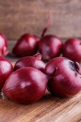 red onions on rustic wood