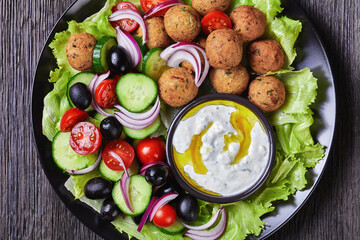 Platter of falafels with vegetables with tzatziki