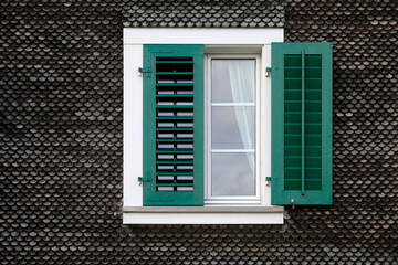 White window frame with green shutters