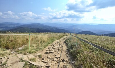 A rocky trail in the Bieszczady Mountains with a wonderful panorama of mountains and clouds © Paweł Kowalczuk