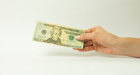 Hand with money isolated on a white background