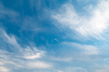 beautiful blue sky with clouds, nature background, film grain noise effect
