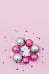Christmas decorations are surrounded by star confetti. New Year card or banner. Selective focus