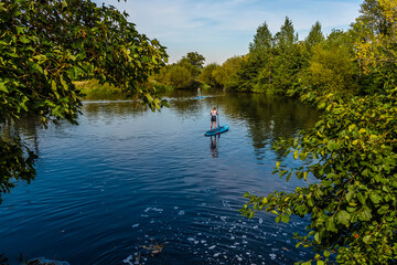 Fototapeta na wymiar A view across a lake at Dedham, Suffolk UK in the summertime