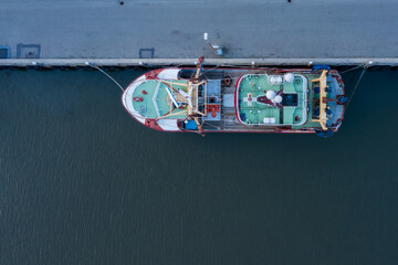 Fishing Trawler tied in the port - fish industry vessel