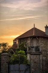 a sunset at the abandoned house