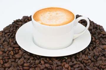Black coffee on a background of beans