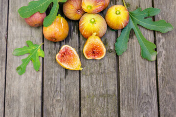 Pink fresh figs on the old wooden table