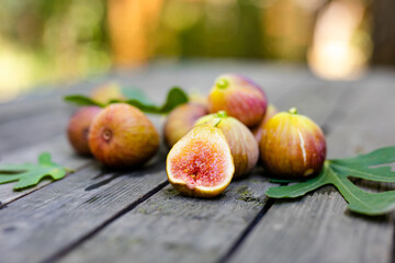 Pink fresh figs on the old wooden table