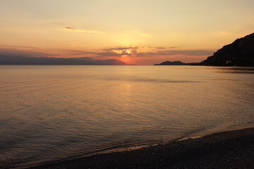 Beautiful sunset over Aegean calm sea, Greece