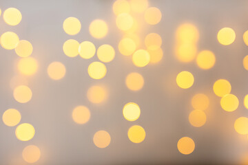 Christmas home room with tree and festive bokeh lighting, blurred holiday background.