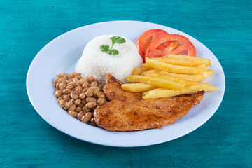 Traditional Brazilian food dish. Blue background. Copy space.