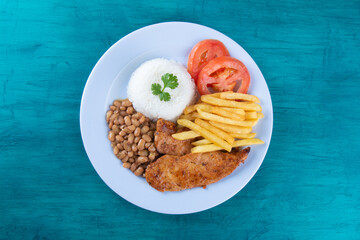 Traditional Brazilian food dish. Blue background. Copy space.