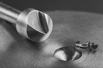 Countersink drill bit make sink in hole in steel billet. Locksmith work.