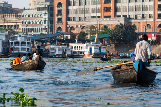 Man rowing his canoe, Port of Dhaka