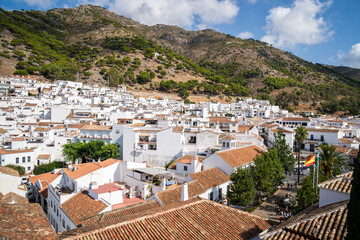 Mountains provide the backdrop to the white washed buildings of Mijas Pueblo, Andalusia, Spain