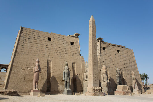 Six Colossi of Ramses II in front of Pylon, Obelisk, Luxor Temple, Luxor, Thebes