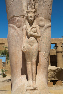 Statue of Nefetari, at base of statue of Ramses II, Great Court, Karnak Temple Complex, Luxor, Thebes