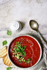 Gazpacho - traditional spanish cold tomato soup. Top view with copy space.