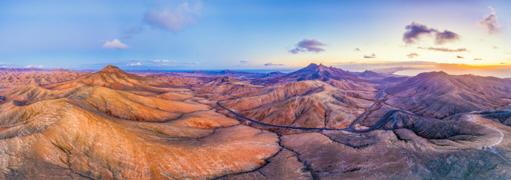 Mountain road crossing the volcanic landscape near Sicasumbre astronomical viewpoint, Fuerteventura, Canary Islands, Spain, Atlantic