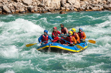 Rafting through white water rapids on the Karnali River in west Nepal
