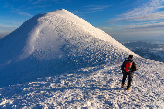 Hiker near the summit in winter, Mount Acuto, Apennines, Umbria