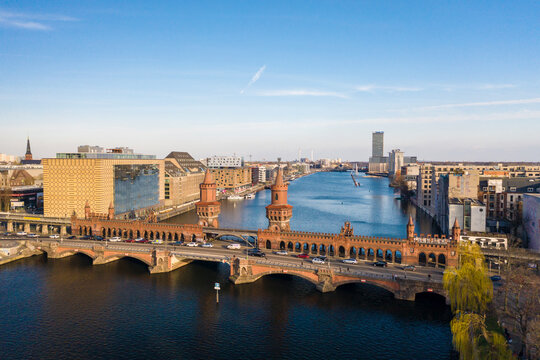View from above of Oberbaum bridge, Spree River and Treptower park in the background, Berlin, Germany
