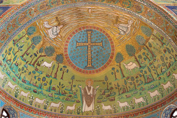 Fototapeta na wymiar RAVENNA, ITALY - JANUARY 29, 2020: The mosaic in the main apse with the early christian cross and symbolic in church Basilica of Sant Apolinare in Classe from the 6. cent.