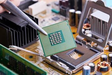 close up view for cpu or central processor chip over circuit board background. electronic industry...