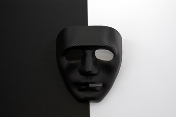 Two masks contrasting with each other