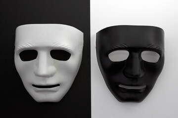 Two masks contrasting with each other