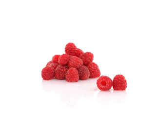 Fresh Raspberries on white reflective background. Isolated