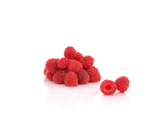 Fresh Raspberries on white reflective background. Isolated
