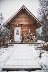A cozy log cabin in the snowy winter landscape