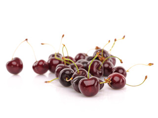 Fresh cherries on white reflective background. Isolated