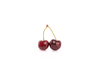 Fresh cherries on white reflective background. Isolated