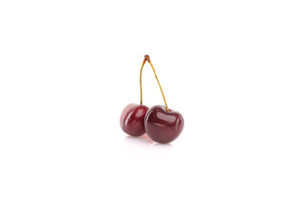 Fresh cherries on white reflective background. Isolated
