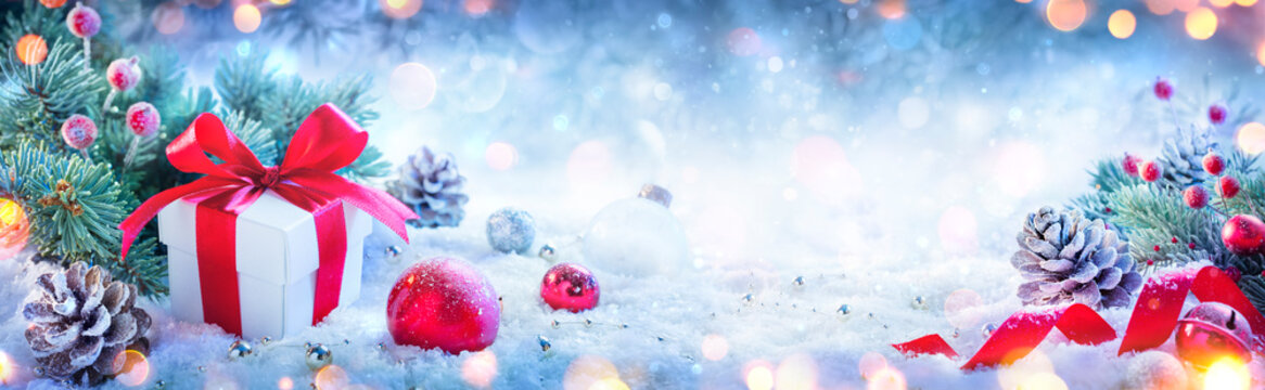 Christmas Present And Ornaments On Defocused Background And Bokeh Lights