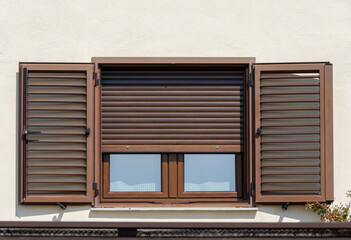 Wooden window with open shutters	