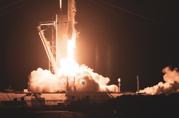 Rocket launch from launchpad at night