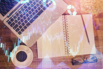 Fototapeta na wymiar Financial market graph and top view computer on the desktop background. Double exposure. Investment concept.