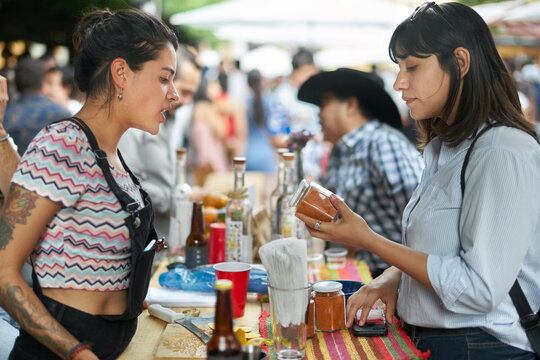 Food market stand with a client