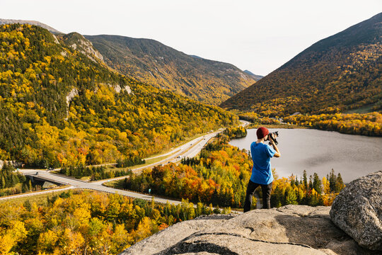 Photographer taking Landscape photos of New Hampshire Fall Foliage
