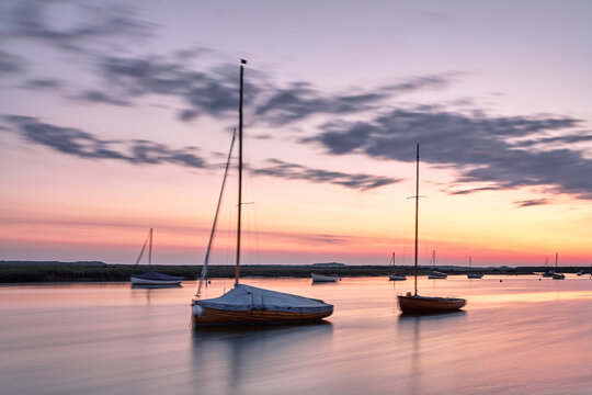 Boats at dawn. Burnham Overy Staithe, Norfolk, UK.