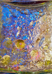 colorful stains on the water close up